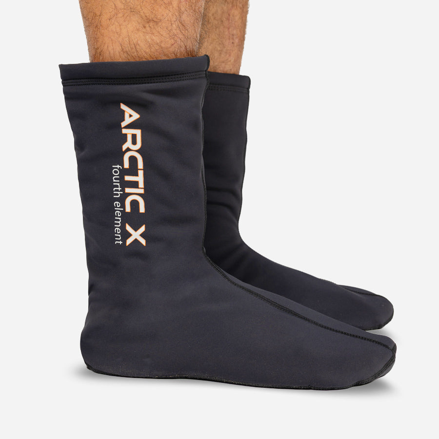Black socks for drysuit diving from fourth element with 'Arctic X' branding on a white background